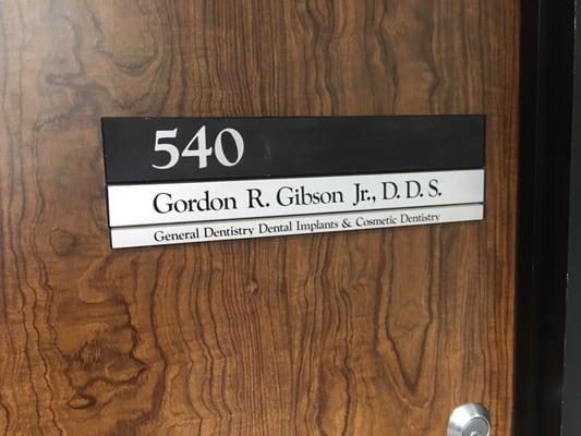 Sign on his door.  His office is off Sam Houston tollway  near Westheimer.