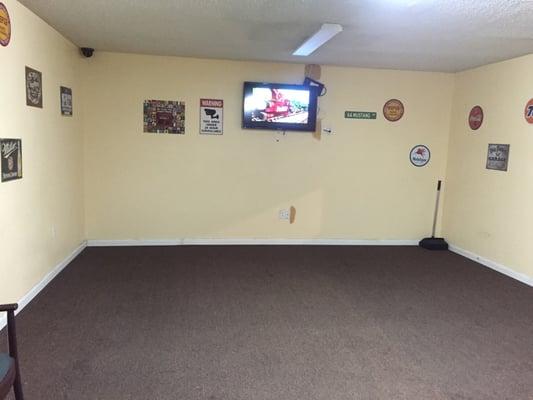 Large air conditioned waiting area with flat screen tv and remote controls so you can watch your favorite show