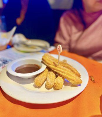 Delish & warm churros with chocolate dipping sauce