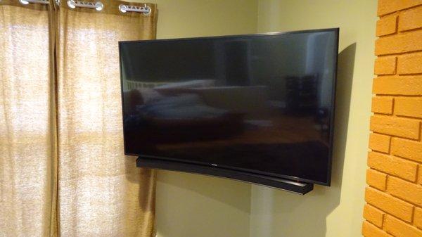 Curved TV and sound bar installation. We had to customize a universal sound bar mount for this install.