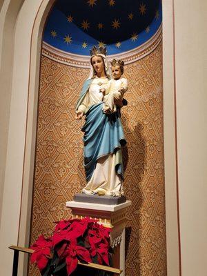 Blessed mother aside the altar