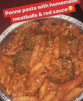 Penne pasta with homemade meatballs and red sauce