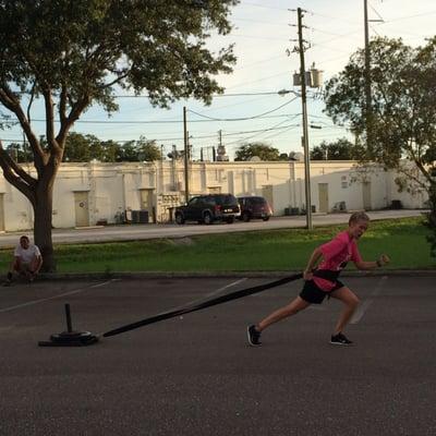 Kat having with sled pulls.