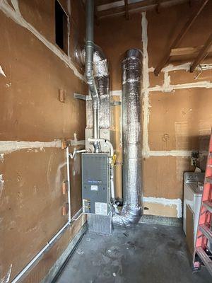 Existing furnace relocated to the garage , duel fuel  with heat pump and new subpanel .