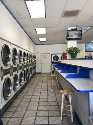 The dryers are free the folding tables run from one end of the dryers to the other.