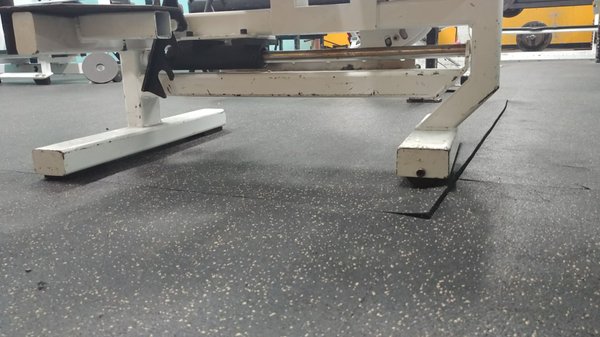 Floor lifting up to be tripped over.