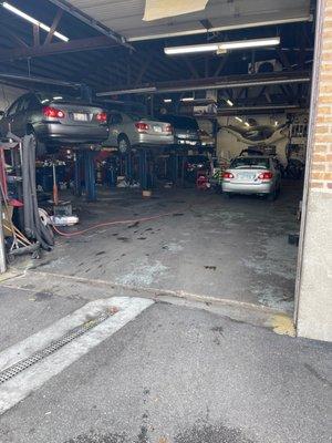 My car being repaired in the open loading dock on a beautiful sunny day. 1 of 3 Toyotas getting repairs