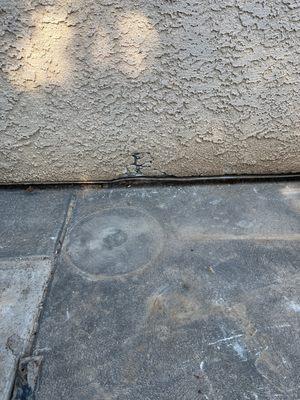 Marks's cement removal team left two holes on my house.