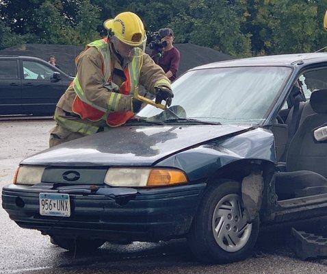 Removing the windshield in a car extrication demonstration.