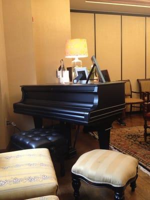 A grand piano. In a dermatology office?!? I just wish someone were playing it.