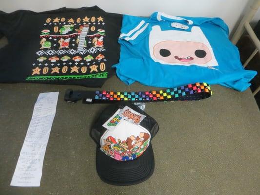 A Mario t-shirt, an Adventure Time t-shirt, a belt, and a Mario hat