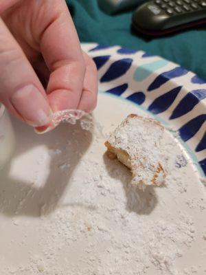 Chunk of plastic or something on the beignet