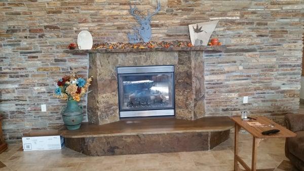 Natural stone fireplace surround.  Make a focal point in your family room!