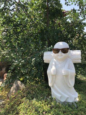 Buddha w/shades on.