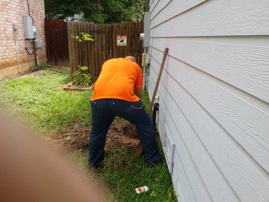 Jeff fixing a water leak he traced into a wall at cuatomers wall.