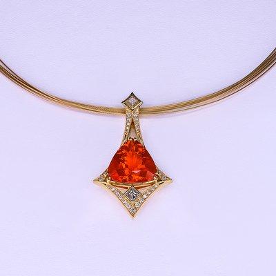 This is a one of a kind Fire Opal Pendant designed by Dan Harrison. 18kt yellow gold and ideal cut diamonds.