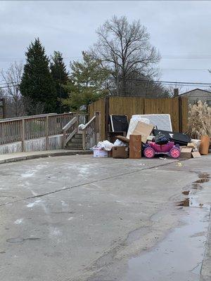 Trash piled up outside the compactor