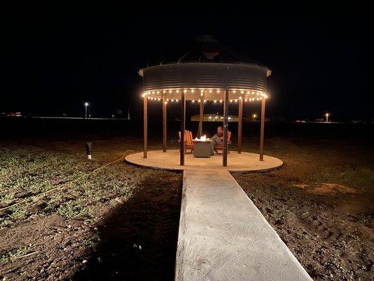 Grain bin gazebo at night.