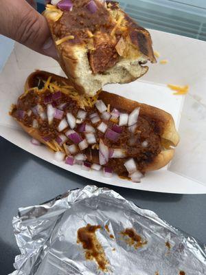 Chili cheese onion and spicy mustard hotdogs