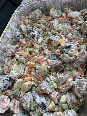 Potato salad with chunks of red potatoes and a little bit of everything! Made with yogurt and mayo! Soooo good!