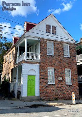 Notice the traditional sky blue porch ceilings which are said to draw insects upward and away from seating + repel evil spirits.