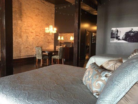 Bedroom and dining area of The Main Floor boutique hotel.