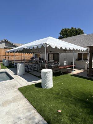 20'x40' tent with set up of 8' rectangular tables and white folding chairs