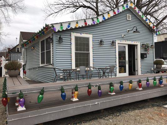 Holiday decor outside the quaint Pilates studio, free public parking is available immediately to the left of this photo.