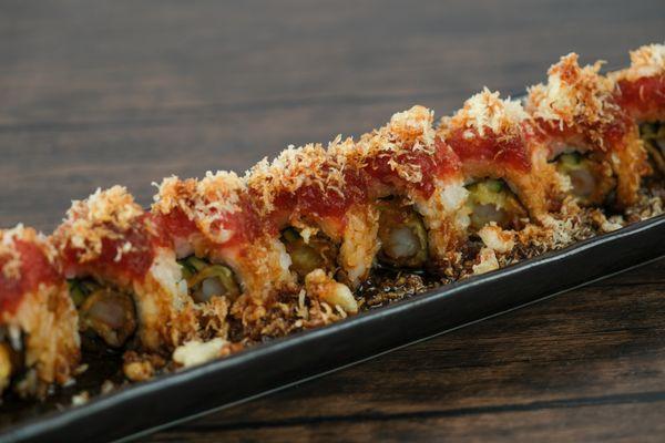 Get ready for a fiery flavor explosion with our Crunch Red Dragon roll!  Savor the crispy crunch and tantalizing spice of this sushi