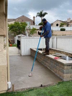 Alex at work on the freshly laid concrete!!! The man is an artist!!!