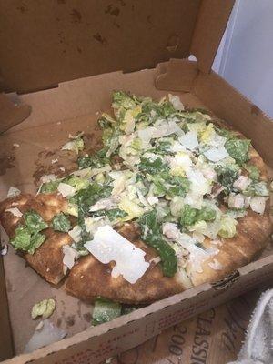 Thin crust 12" Thin Crust Chicken Caesar Pizza -- literally just Caesar salad thrown onto a bare (not so thin) pizza crust ‍