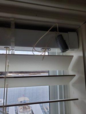 Cord to raise and lower blinds wrapped around top of frame