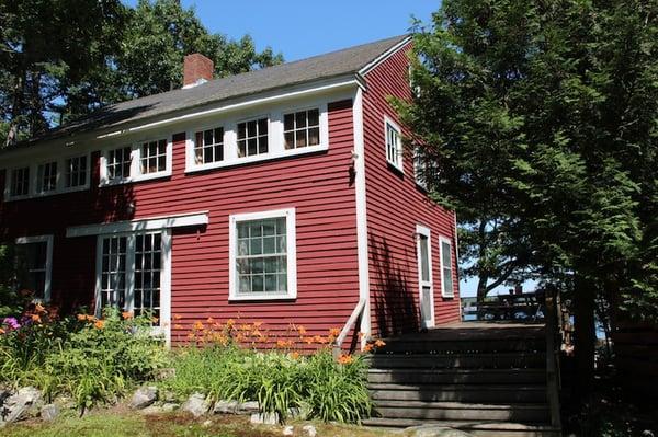 The Lodge at Harborfields features a large living room and six bedrooms with three bathrooms, sleeping up to 9 or 10 people.