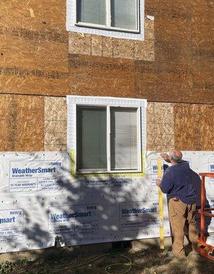 New windows, weather proofing and new siding.