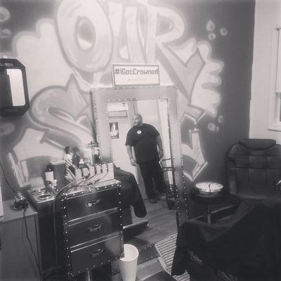 Oscar the barber/owner looking at his domain.  Graff piece done by him also.