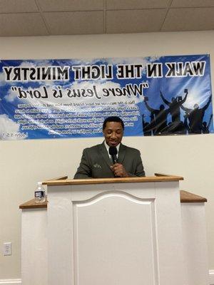 Pastor Davis preaching on Sunday morning