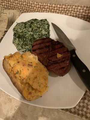 Filet, twice baked potato, and creamed spinach