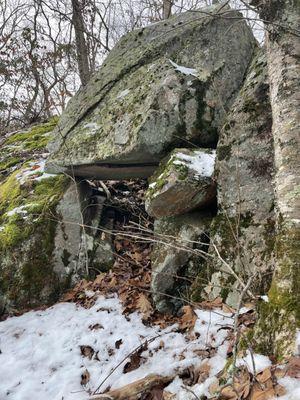 A large glacial boulder outcrop that maybe has a cave ...  or a cold cellar?