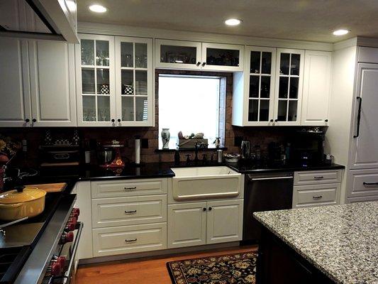 (2 of 3)  Kitchen with Island. Sub Zero Refrigerator panels. Custom Hood.