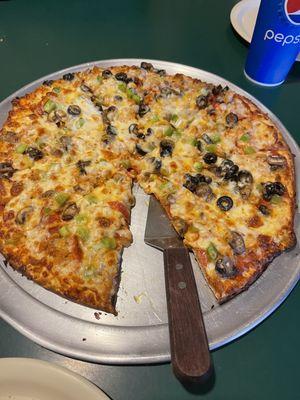 One of there specialty pizzas without black olives on half