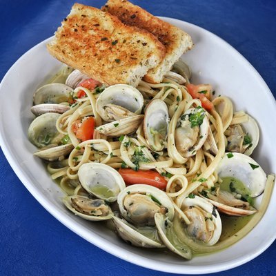 LINGUINI WITH STEAMED LITTLE NECK CLAMS (OR Grilled Chicken OR Grilled Shrimp) with Fresh Garlic, Basil and Grilled Focaccia Bread.