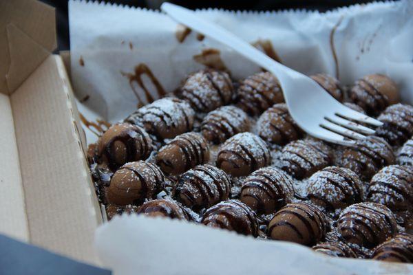 Chocolate Banana Waffle with chocolate syrup and powdered sugar