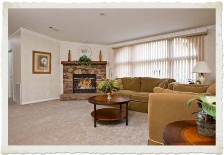 PRESTIGE HOME CENTER. MOBILE HOME INSIDE VIEW WITH FIREPLACE.