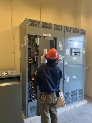 Electrical engineer performing a site audit with category 2 PPE