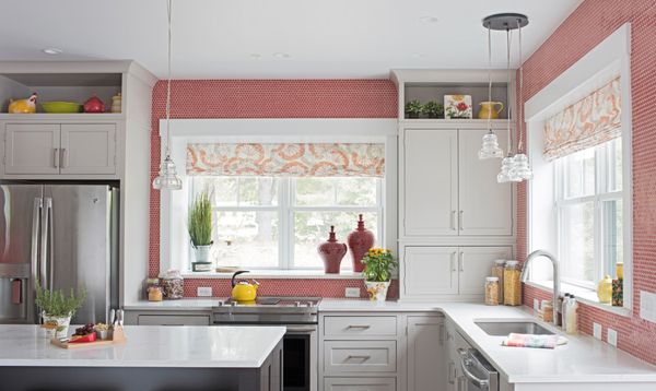 Fabric Roman Shades can add a pop of color and pattern to a white kitchen