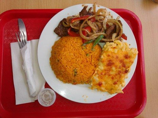 Pepper steak, yellow rice, side of Mac and cheese