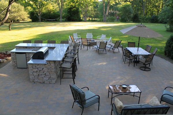 Patio and grilling station with fire pit installed by Yard Works Inc in Tewksbury Ma