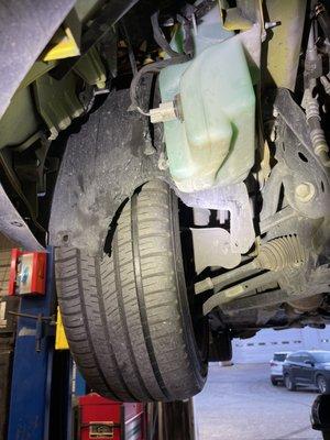 Damaged fender liner due to missing undercarriage