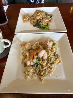 The top dish is noodles with pork, the bottom dish is Thai fried rice with shrimp.