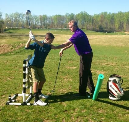 Lead PGA Instructor/Master Club Fitter, Parker Parsons working w/ junior player Brett Shamleffer on his transition move from top